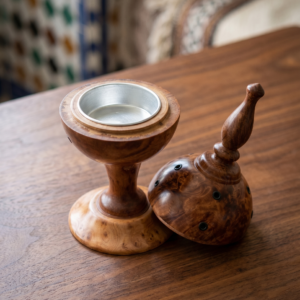 Top-down angle of the open Artbeldy wooden mabkhara, highlighting the smooth metal interior cup against the intricate thuya burl wood texture of the resting lid.
